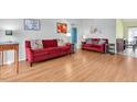 Spacious living room showcasing new wood floors and comfortable seating at 3403 36Th W St # 109, Bradenton, FL 34205