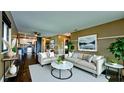 Bright living room featuring modern decor, neutral tones, and seamless access to the kitchen at 3500 El Conquistador Pkwy # 336, Bradenton, FL 34210