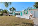 Charming single-story home with turquoise accents, well-maintained lawn, and sunny Florida charm at 5724 25Th W St, Bradenton, FL 34207