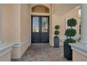 Elegant double front doors with decorative glass and brick pavers offer a grand entrance to the home at 1007 3Rd E St, Palmetto, FL 34221