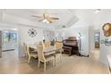 Bright dining room featuring a large table, an organ, recessed lighting, and views of other rooms at 25188 Marion Ave # E208, Punta Gorda, FL 33950