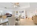 Bright dining room featuring a large table, an organ, recessed lighting, and views of other rooms at 25188 Marion Ave # E208, Punta Gorda, FL 33950