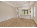 Spacious living area with tile floors opens to the kitchen with bar seating at 309 Potenza Loop, Nokomis, FL 34275