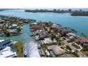 Waterfront home with a pool, dock, and lush landscaping in a desirable neighborhood at 355 W Royal Flamingo Dr, Sarasota, FL 34236