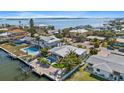 Beautiful waterfront property featuring a private pool, lush landscaping, and stunning water views at 504 Bayview Dr, Holmes Beach, FL 34217