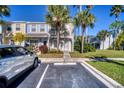 Inviting townhouse with vibrant landscaping, designated parking, and majestic palm trees at 4717 Sabal Key Dr, Bradenton, FL 34203