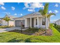 A beautiful single story home featuring an attached garage and a meticulously landscaped front yard at 8071 Slipway Dr, Sarasota, FL 34240