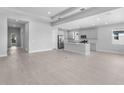 An open-concept living area featuring tile floors, recessed lighting, and a kitchen with modern appliances at 8071 Slipway Dr, Sarasota, FL 34240