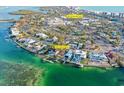 An aerial view shows the property's waterfront location and proximity to the downtown area and the beach at 244 N Washington Dr, Sarasota, FL 34236