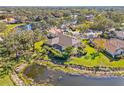 Waterfront home with screened-in pool and tranquil pond views at 4477 White Cedar Trl, Sarasota, FL 34238
