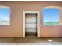 View of the elevator with great exterior light streaming in from the side windows at 5246 Manorwood Dr # 4, Sarasota, FL 34235