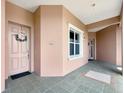 Inviting condo hallway with a view of the front door and exterior window at 5246 Manorwood Dr # 4, Sarasota, FL 34235