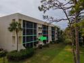 Exterior patio includes outdoor seating, screen windows, and access to an outdoor garden at 6116 43Rd W St # 204D, Bradenton, FL 34210