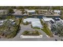 Beautiful home featuring a waterfront view, private dock, and easy access to boating and waterfront activities at 619 Buttonwood Dr, Longboat Key, FL 34228