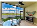 Relaxing screened lanai with comfortable seating and beautiful views of the golf course and lake at 7019 River Hammock Dr # 104, Bradenton, FL 34212