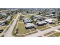 Wide aerial view of residential neighborhood showcasing many homes, streets and community layout at 211 Dalton Blvd, Port Charlotte, FL 33952