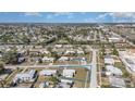 Extensive aerial view of a community, highlighting neighborhood streets and many residences at 211 Dalton Blvd, Port Charlotte, FL 33952
