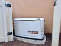 A Generac 16kW generator is installed on a concrete pad beside the home for reliable backup power at 5020 Savona Run, Bradenton, FL 34211