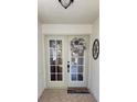 Welcoming entryway featuring double doors and decorative accents at 625 Duchess Blvd, Dunedin, FL 34698