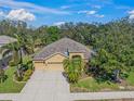 Beautiful house with a well-manicured lawn and mature landscaping, offering great curb appeal at 7911 Kavanagh Ct, Sarasota, FL 34240