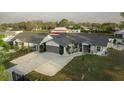 Charming single-story home with a gray roof, fresh paint, and landscaped front yard at 9716 28Th E St, Parrish, FL 34219