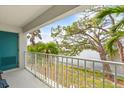 Balcony overlooking a lake with seating area and ample space at 312 108Th W St, Bradenton, FL 34209
