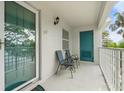 Inviting front porch with seating area and an interesting colored door at 312 108Th W St, Bradenton, FL 34209