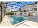 Beautiful screened-in pool and spa area with spacious patio at 4620 Riverview Blvd, Bradenton, FL 34209