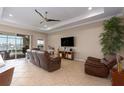 Living room with neutral walls, recessed lighting, and sliding door access to the pool at 5040 Lake Overlook Ave, Bradenton, FL 34208