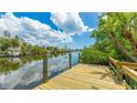 Waterfront home featuring a private dock with beautiful canal and water views at 5135 Riverwood Ave, Sarasota, FL 34231