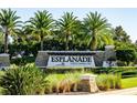 Welcoming entrance to Esplanade Golf & Country Club with lush landscaping and elegant signage, creating a luxurious first impression at 13038 Prima Dr, Bradenton, FL 34211