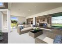 Inviting covered patio with an outdoor seating area, offering seamless indoor-outdoor living at 16435 Umbria Pl, Bradenton, FL 34211