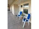 View of a cozy balcony with chairs and a plant, unit 2607 at 2607 Woodgate Ln # K9, Sarasota, FL 34231