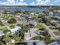 Aerial view showcasing the property's location with waterfront views and a neighborhood with mature trees at 333 Bayshore Dr, Venice, FL 34285
