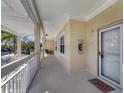 Comfortable condominium balcony entrance with white railings and outdoor seating at 3803 54Th W Dr # 203, Bradenton, FL 34210