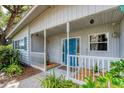 Close-up of a charming covered front porch, showcasing the home's welcoming entrance at 4062 S Shade Ave, Sarasota, FL 34231