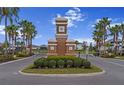 Community entrance to Worthington with palm trees and manicured shrubbery at 4793 Antrim Dr, Sarasota, FL 34240