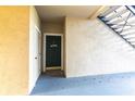 Front door view with door number 110, showcasing a secure entrance and a welcome sign at 5122 Northridge Rd # 110, Sarasota, FL 34238
