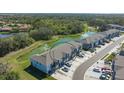 Aerial view of the townhomes backing onto lush green space, offering privacy and scenic views at 8612 Milestone Dr, Sarasota, FL 34238