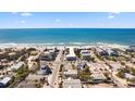 Breathtaking aerial view of beach homes showcasing the neighborhood's close proximity to the ocean at 204 66Th Street, Holmes Beach, FL 34217
