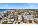 Coastal home featuring a metal roof with balconies offers easy access to the beach and local amenities at 204 66Th Street, Holmes Beach, FL 34217