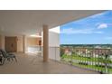 Outdoor hallway space with white railing overlooking a residential area at 2625 Terra Ceia Bay Blvd # 504, Palmetto, FL 34221