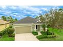Charming single-Gathering home with attached garage, well-manicured lawn, and mature landscaping at 3839 Autumn Fern Ter, Sarasota, FL 34243