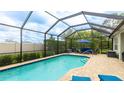 Inviting screened-in pool area with comfortable seating, perfect for outdoor relaxation and entertainment at 3839 Autumn Fern Ter, Sarasota, FL 34243
