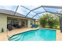 Beautiful screened-in pool with patio area, perfect for relaxing and entertaining guests at 3839 Autumn Fern Ter, Sarasota, FL 34243