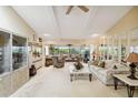 Spacious living room featuring plush carpeting, neutral tones, and plenty of natural light at 534 Warwick Ln, Venice, FL 34293
