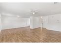 Spacious living room featuring tile floors, neutral paint, and recessed lighting throughout at 5798 Kenwood Dr, North Port, FL 34287