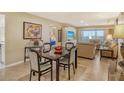 Dining room with black table and seating in open concept floor plan at 1125 W Peppertree Dr # 706, Sarasota, FL 34242