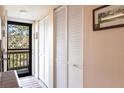 Inviting entryway featuring closet space, a view of the screened lanai, and plenty of natural light at 1531 Clower Creek Dr # Ha245, Sarasota, FL 34231