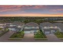 Aerial view of home and community featuring nearby lakes and mature trees at 16438 Slate Pl, Lakewood Ranch, FL 34211